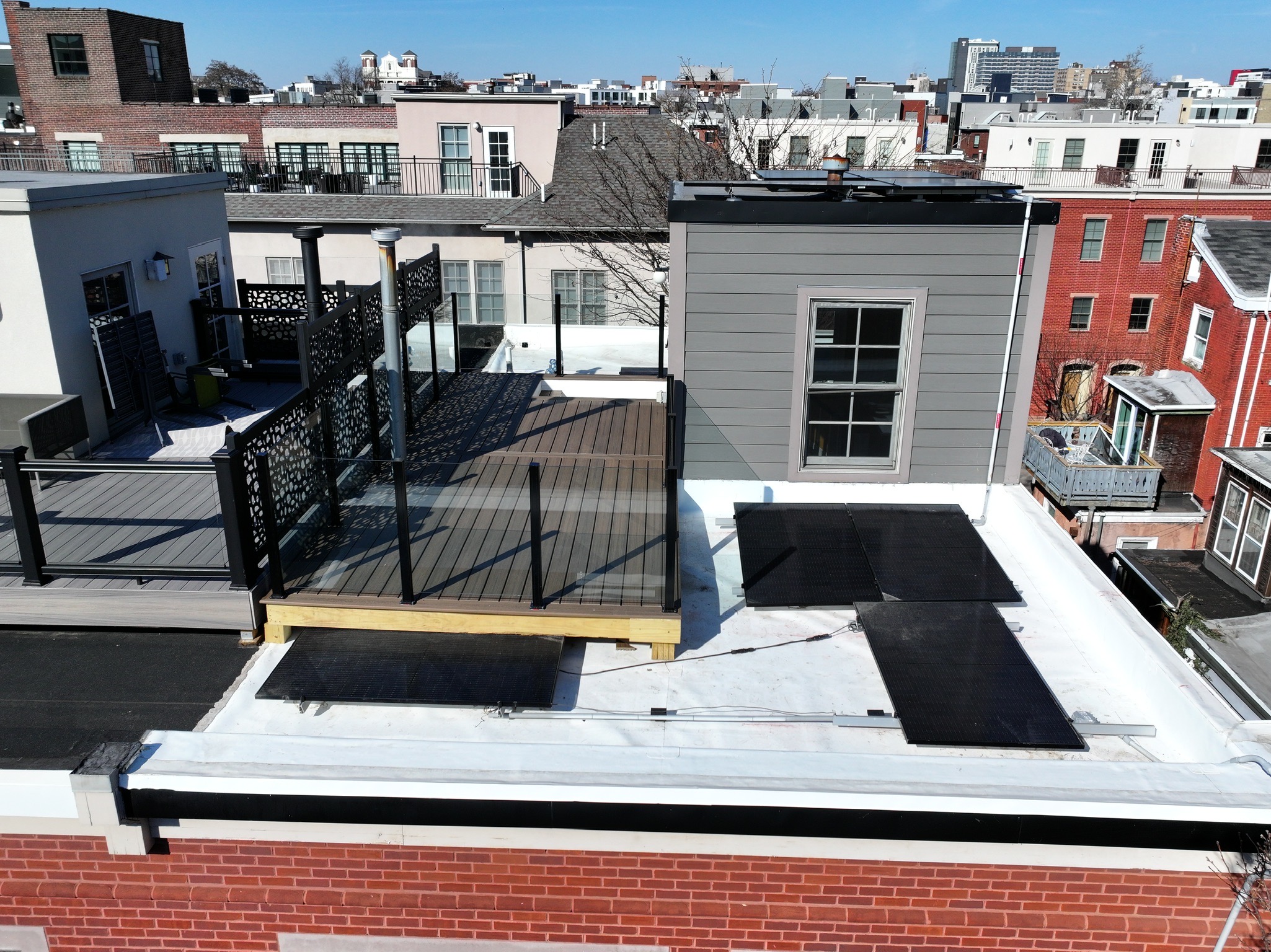 Custom Trex deck with glass railings at 2413 North St, Philadelphia
